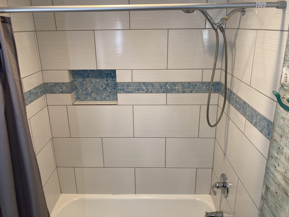 Hideaway shower tub.