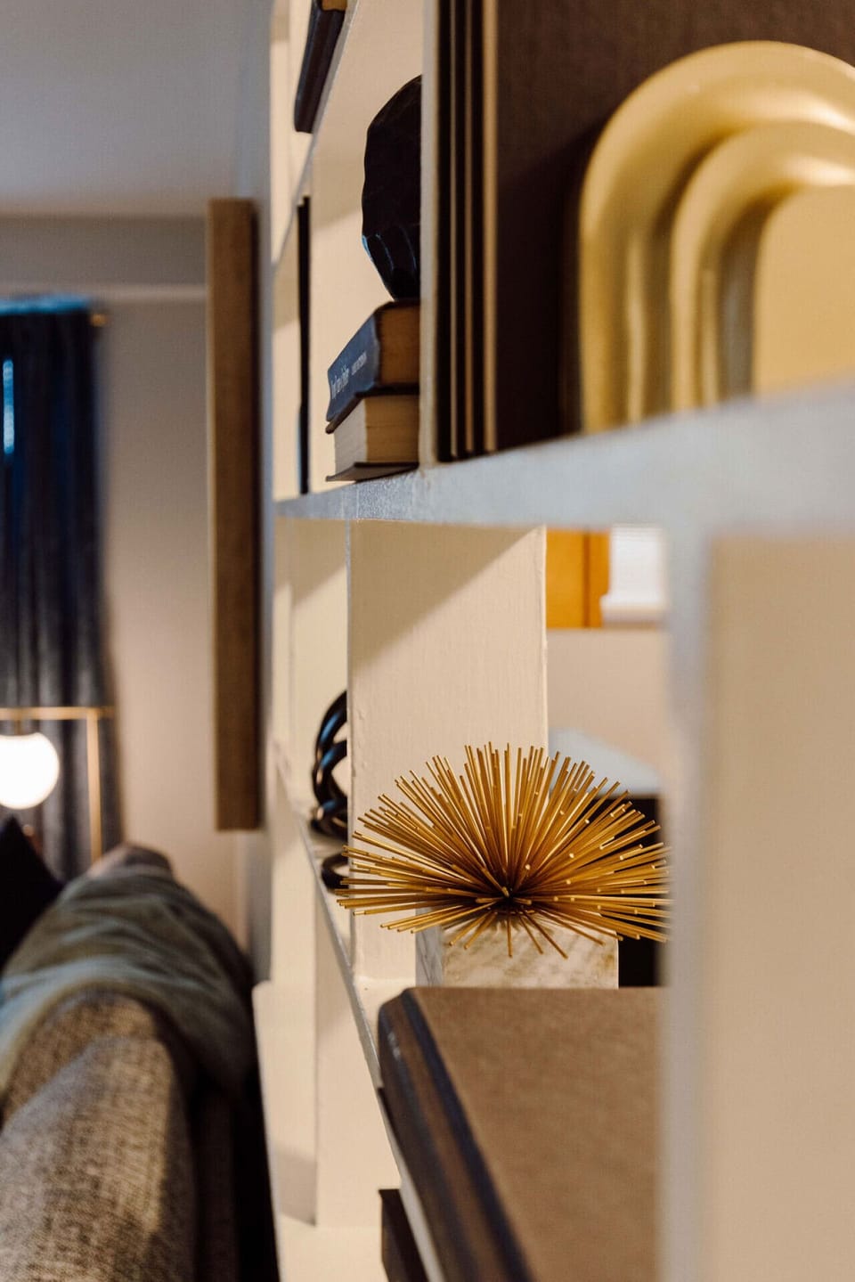 This bathroom is furnished with a toilet, sink, bathtub, and an overhead shower for your convenience