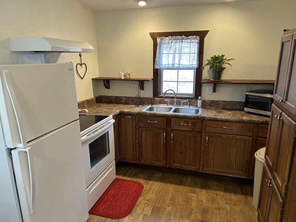 Full refrigerator with ice maker and oven/stove