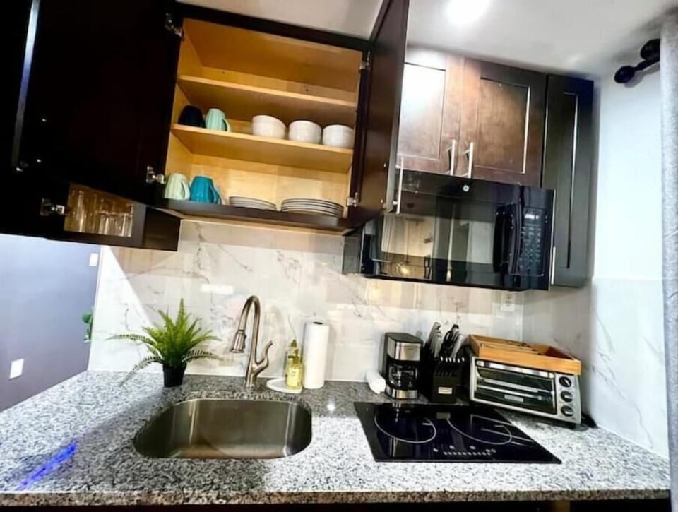 Kitchenette includes a small fridge, double plate burners, toaster oven, etc...