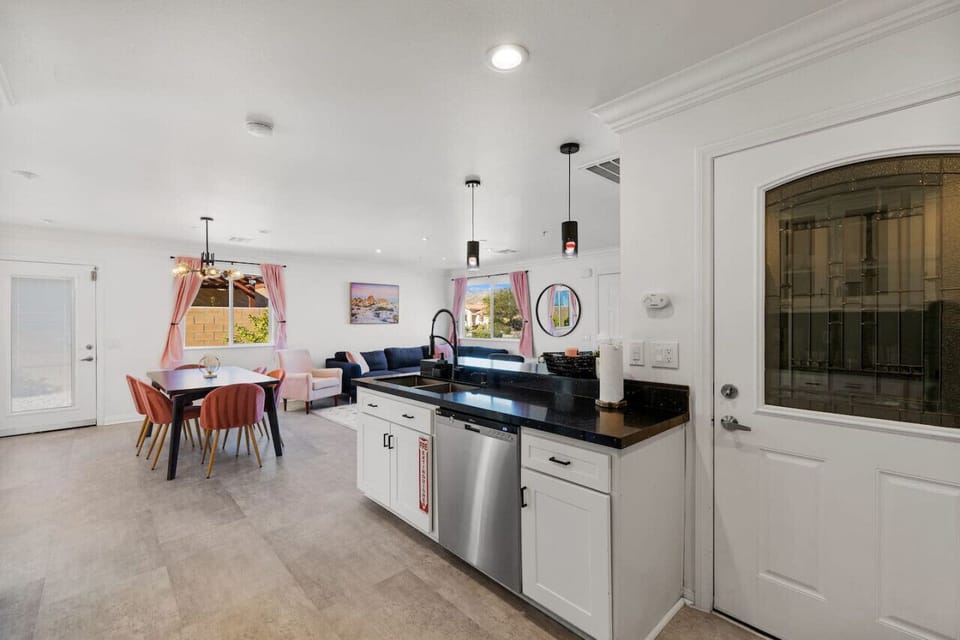 Bright dining space beside the kitchen, set up for easy meals and casual gatherings.