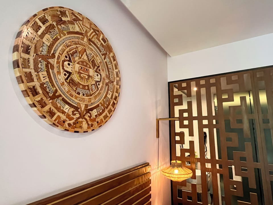 Featured wooden carved Aztec calendar.