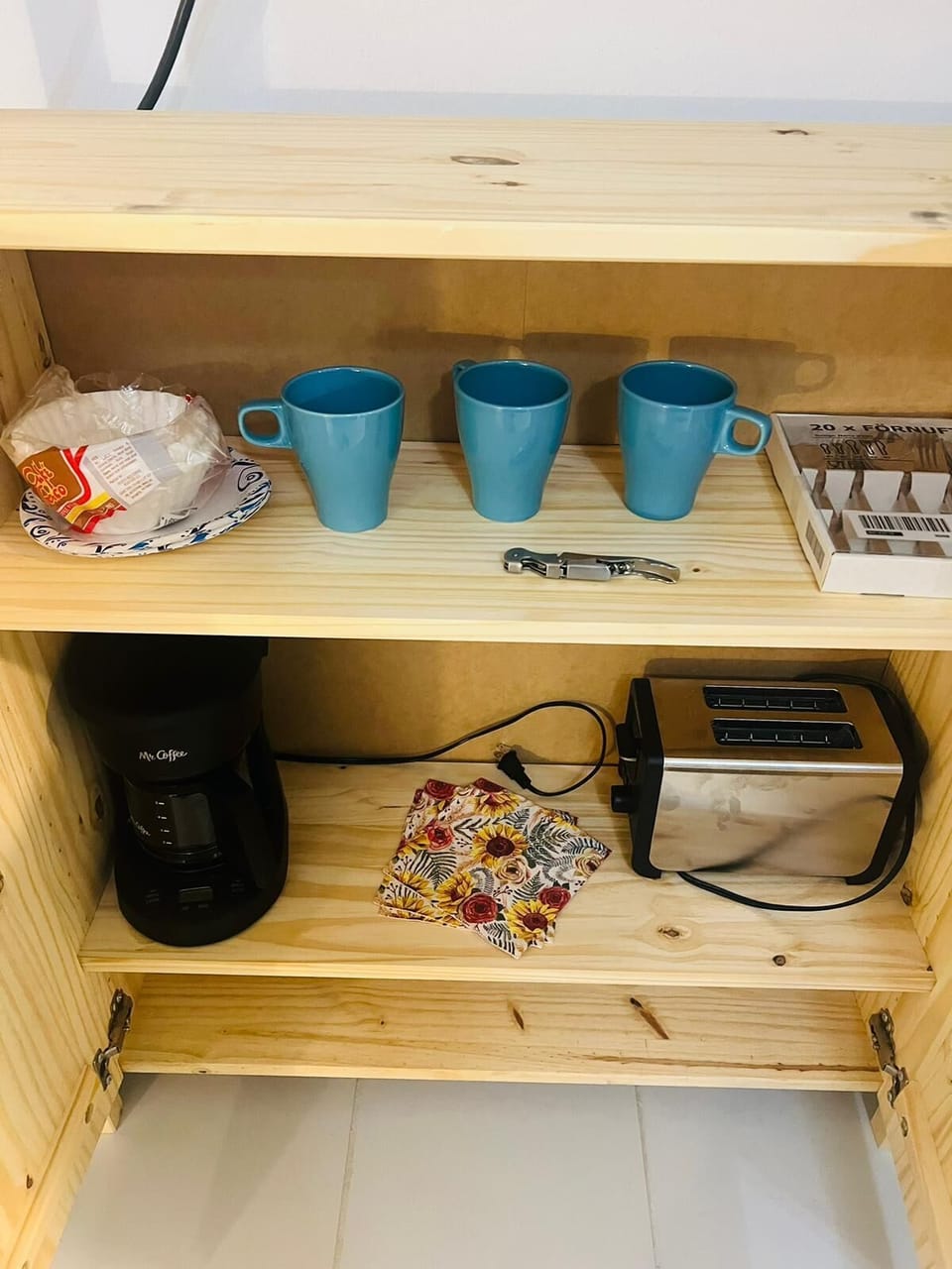 The room is equipped with a coffee maker, microwave, toaster and refrigerator