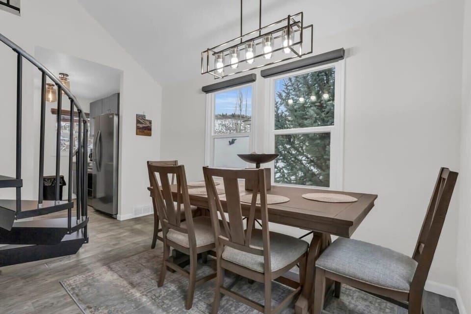 Enjoy meals with your group at the dining table, from which you can enjoy views all around from the large windows framing the surrounding trees.