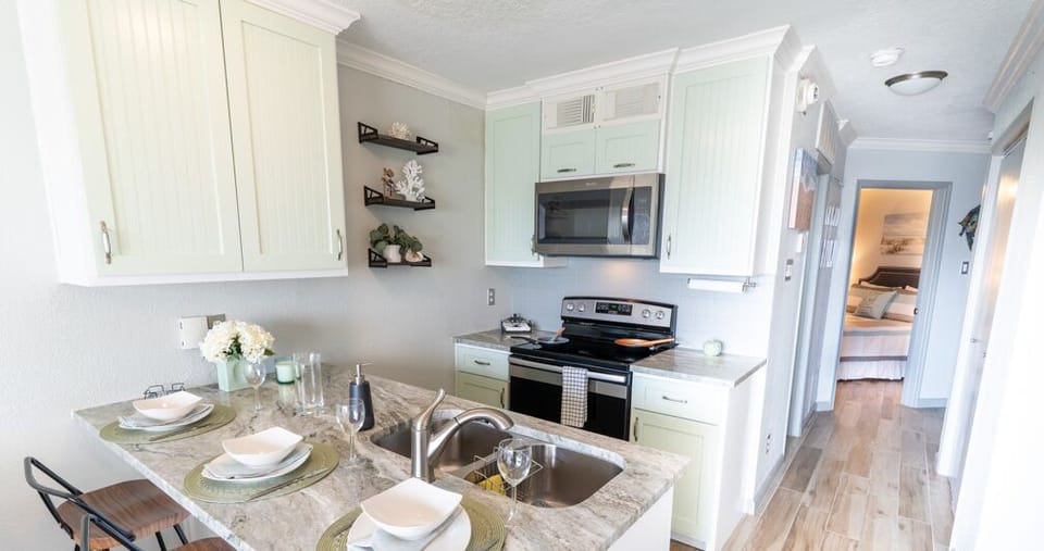 To the fully equipped kitchen that boasts