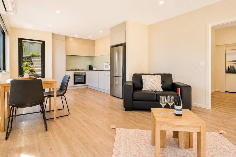 Bright and comfortable living area with beautiful Derwent River views and plenty of natural light.