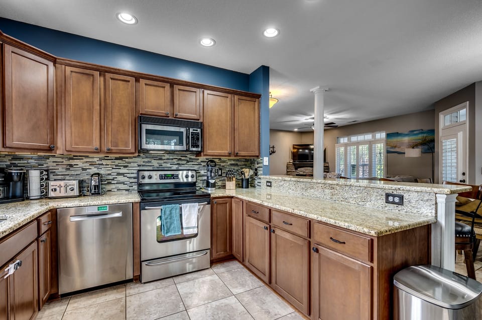 Culinary dreams come true! Our fully stocked kitchen is a stainless steel sanctuary with bar seating for 4, an electric stove top, and a pantry big enough to satisfy every snack craving. Cook up memories with a side of ocean vibes—your seaside feast starts here! 