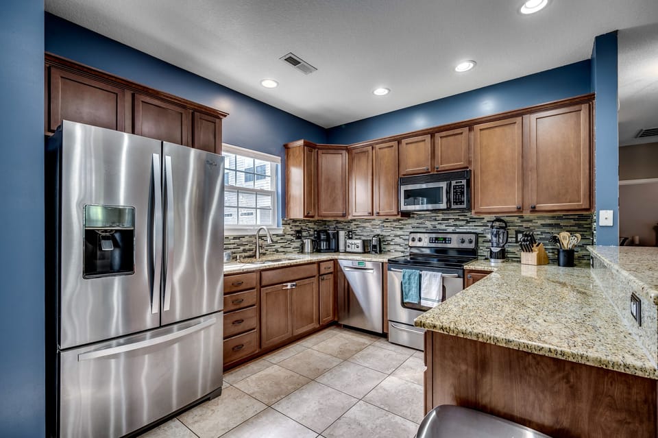 Culinary dreams come true! Our fully stocked kitchen is a stainless steel sanctuary with bar seating for 4, an electric stove top, and a pantry big enough to satisfy every snack craving. Cook up memories with a side of ocean vibes—your seaside feast starts here! 
