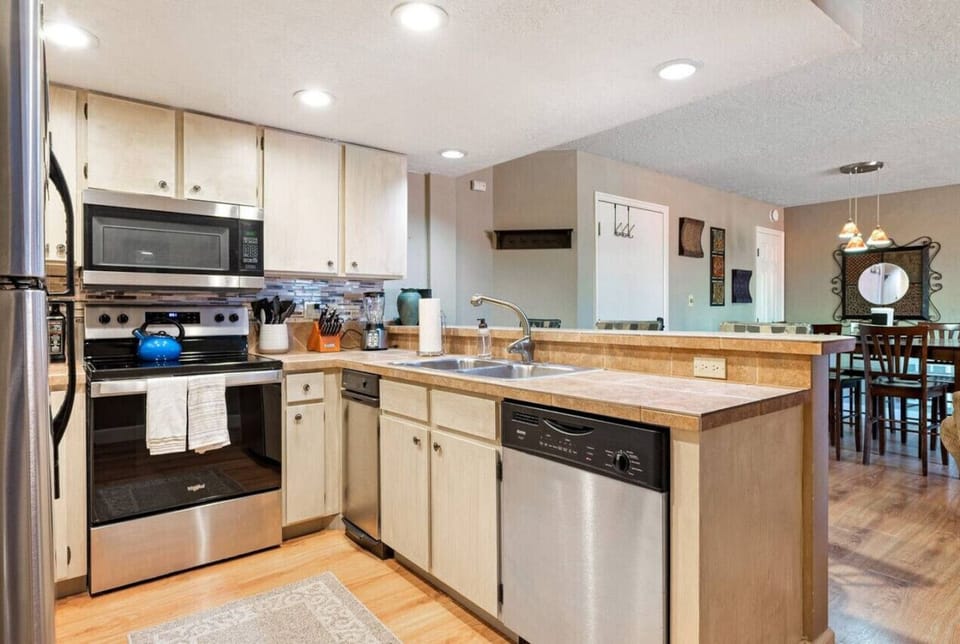 Enjoy the convenience of a fully equipped kitchen, complete with a coffee/tea maker, kettle, stove, toaster, dishwasher, microwave, and oven.