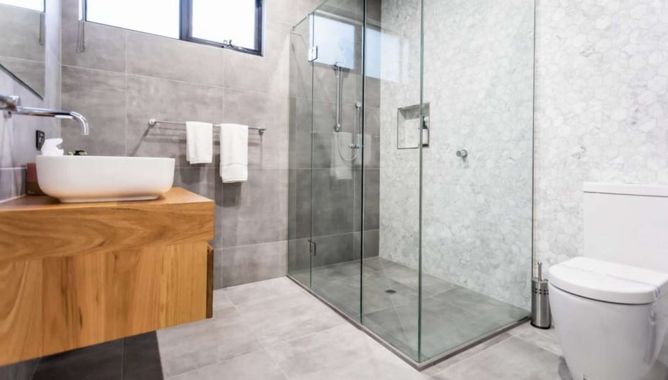 Bathroom with Shower, vanity and toilet