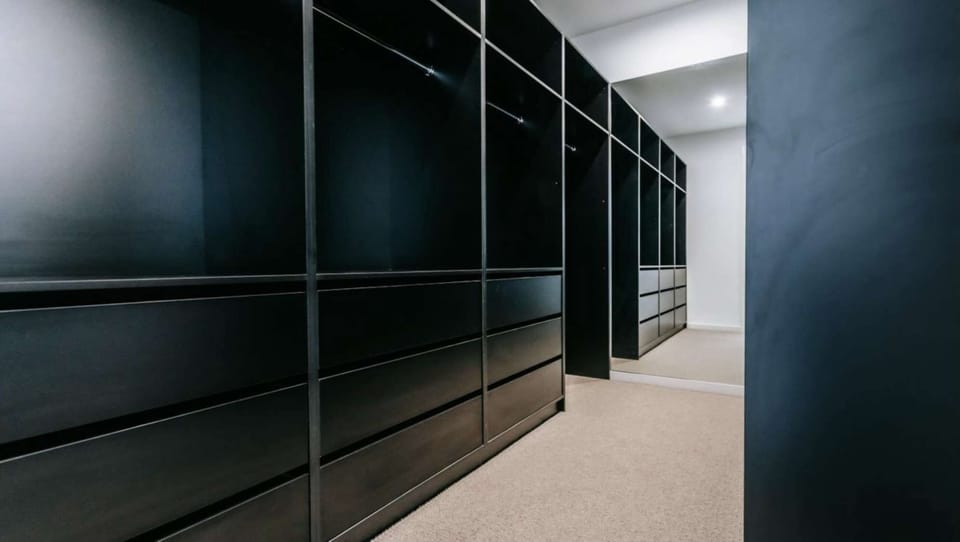 Walk in wardrobe in master bedroom