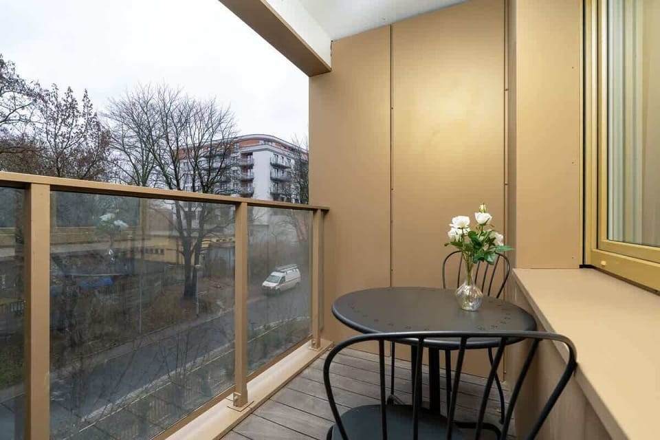 A balcony with outdoor seating overlooking a scenic view, perfect for relaxing and enjoying the fresh air.
