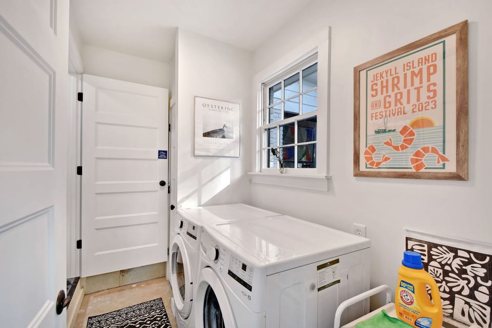 Laundry Room with Full-Size Machines - Washer, dryer, sink, and storage help with beach clothes and longer Jekyll Island stays.