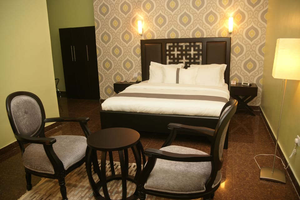 In-room safe, desk, laptop workspace, bed sheets