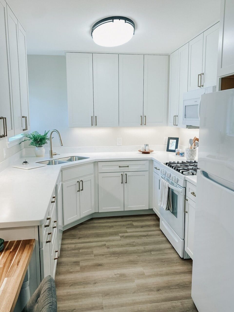 Fully-equipped kitchen with solid surface countertops - you'll have everything you need in this kitchen! From Our Place cookware, to Ninja Blender & Kitchen Aid hand mixer, and so much more.