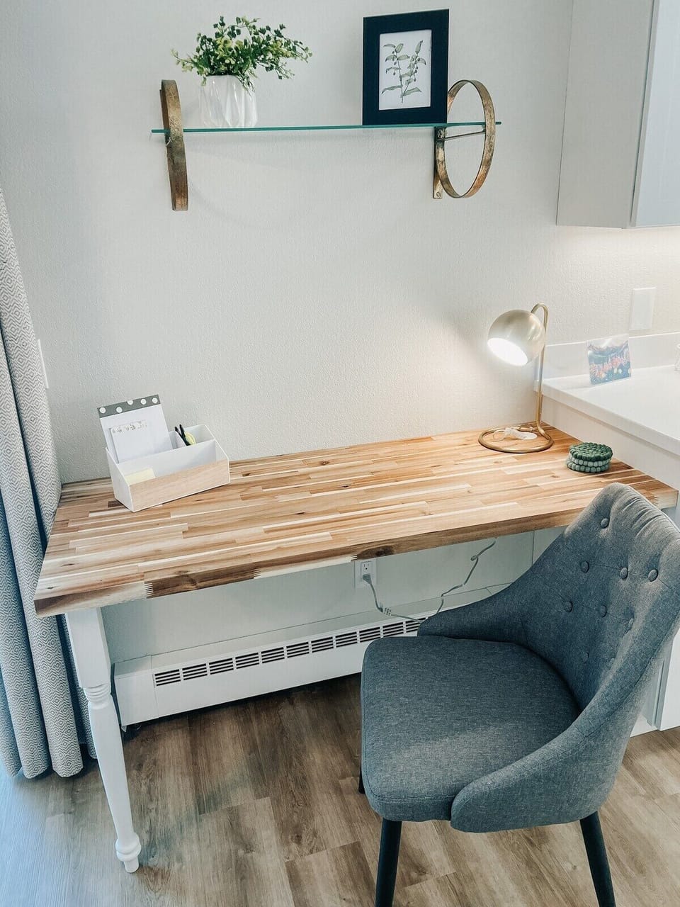 Off-the-kitchen cozy, work space with table lamp.
