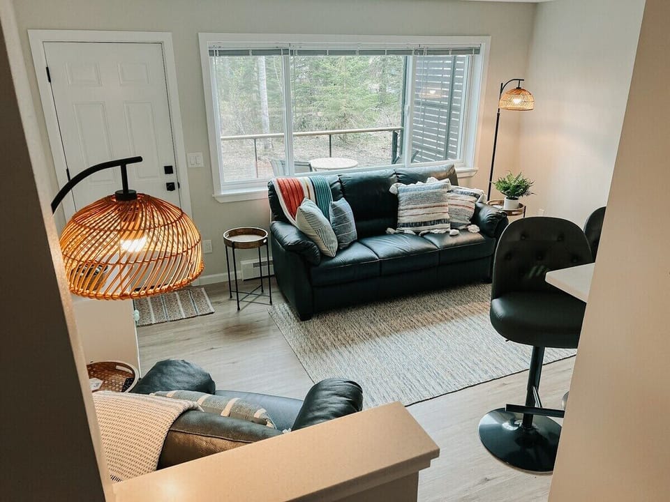 Ample seating in this living space offers a great spot to eat, gather, or relax.