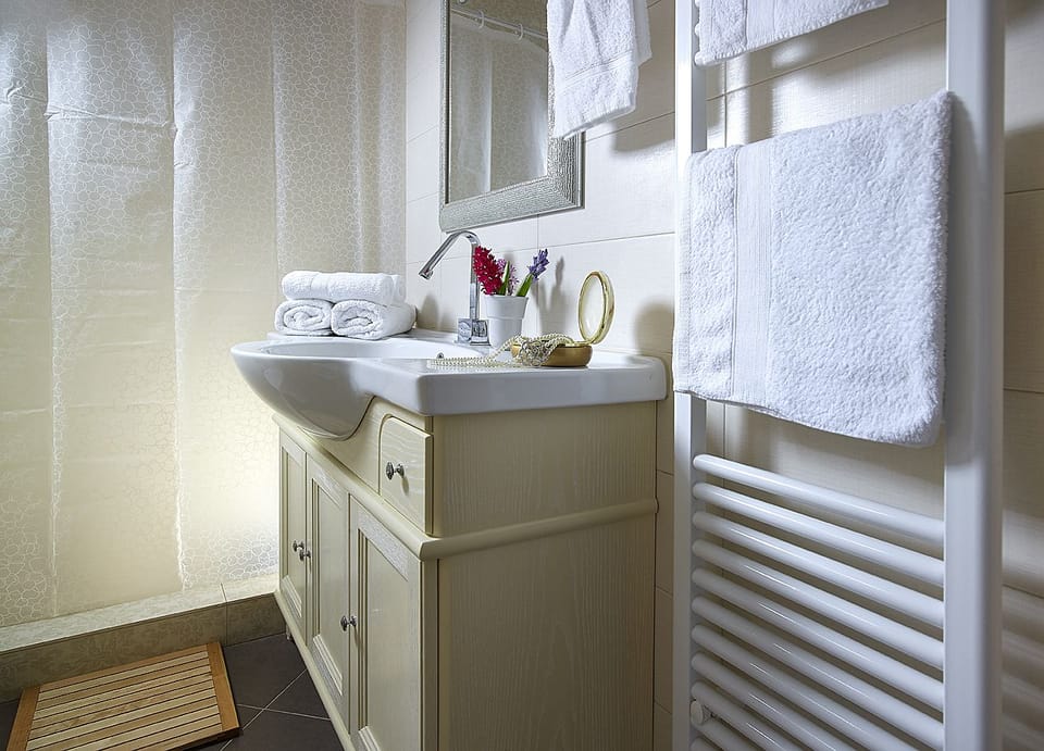 Family Suite, 2 Bedrooms, Sea View | Bathroom | Shower, hair dryer, slippers, towels