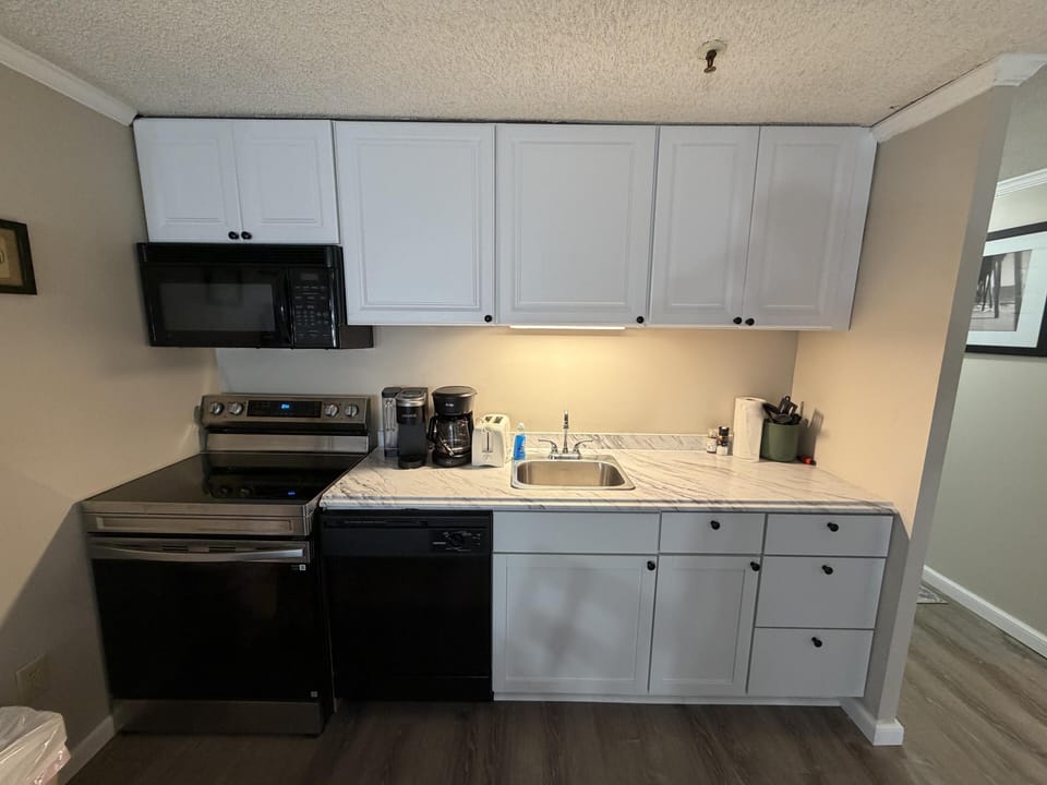 Bright, modern kitchen with appliances and ample storage