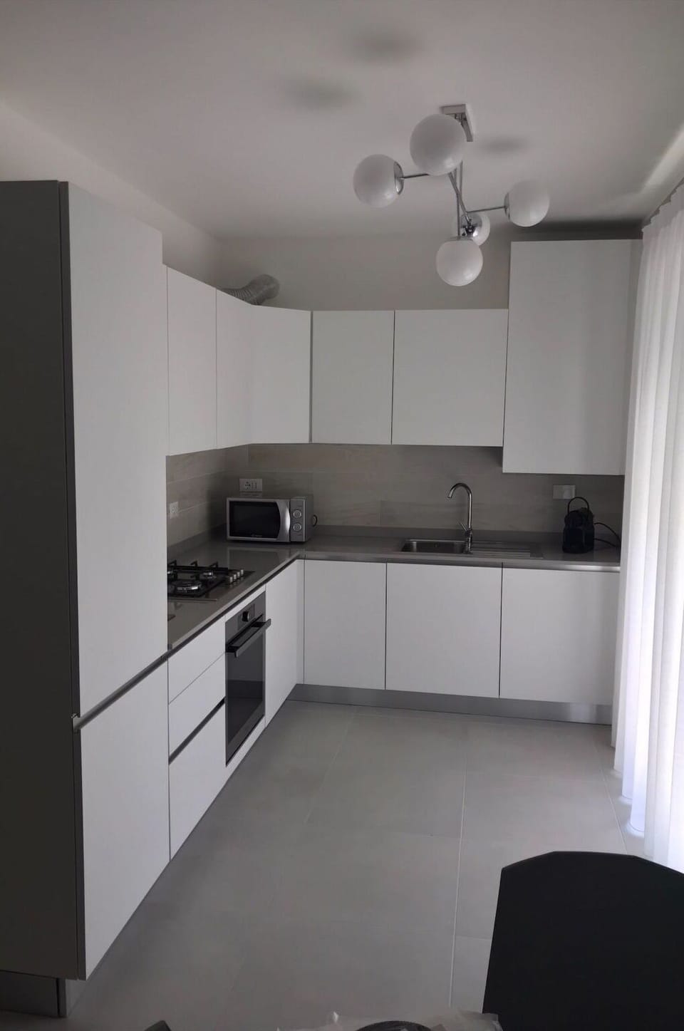Cabinetry, Property, Countertop, Sink, Kitchen Stove, Lighting, Curtain, Kitchen, Interior Design, Wood