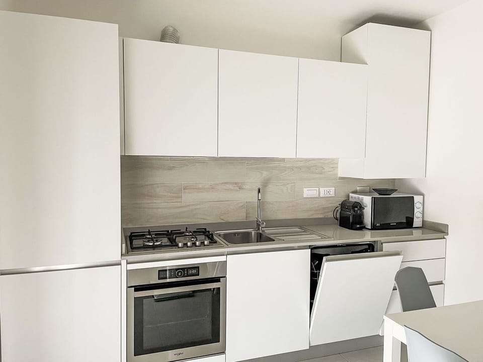 Cabinetry, Kitchen Appliance, Countertop, Kitchen, Kitchen Stove, Building, Home Appliance, Cooktop, Major Appliance, Flooring