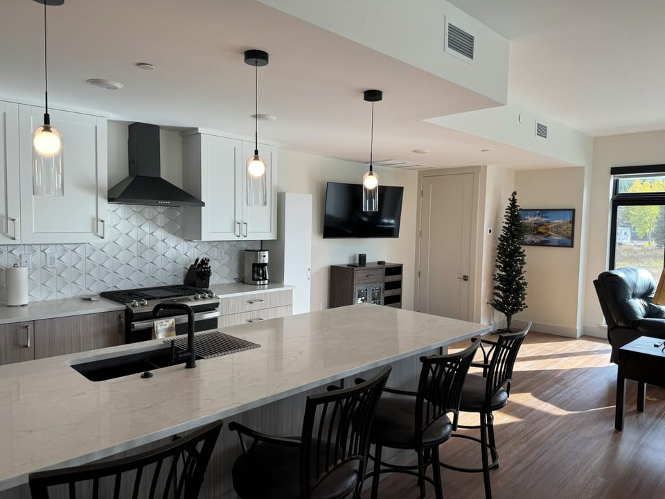 Kitchen looking towards tv above bar