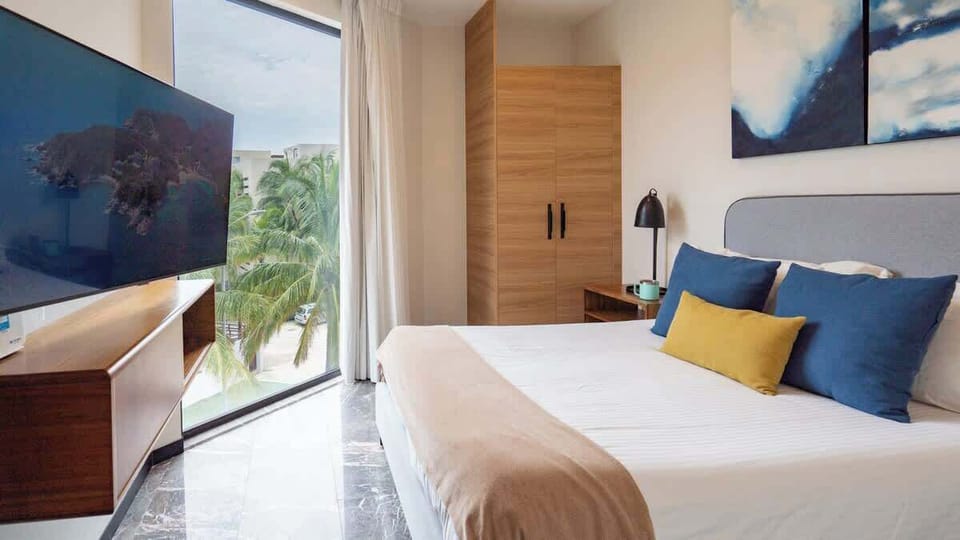 Bedroom with Caribbean touches and exterior views.