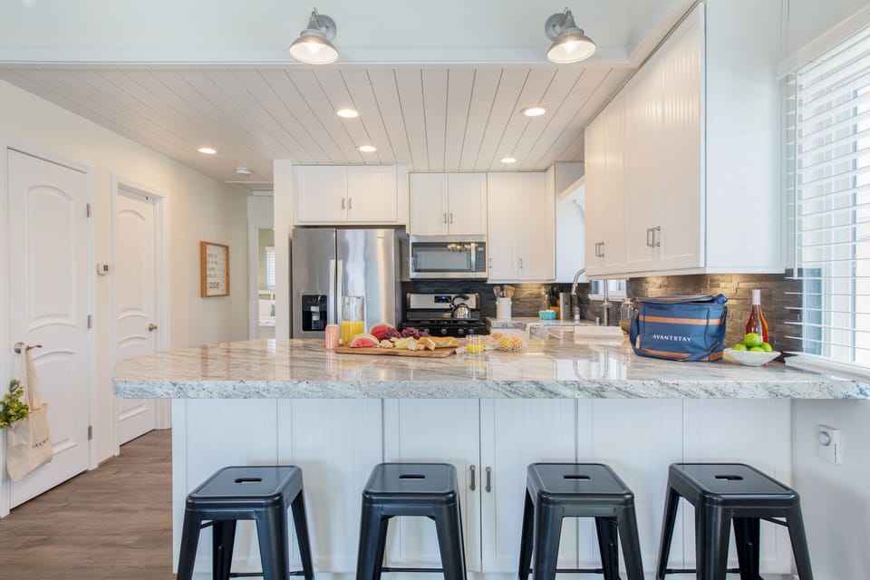 Barstool seating at the kitchen counter.