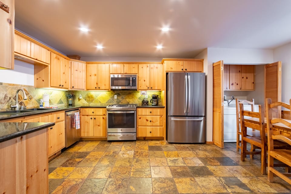 Fully-equipped kitchen with modern appliances.