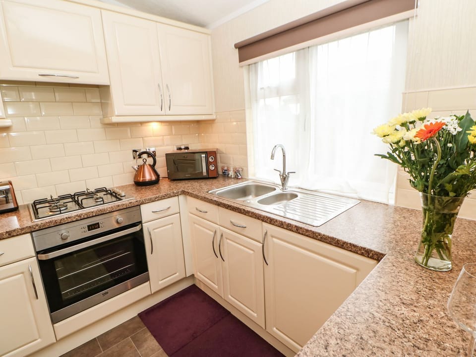 Fridge, electric kettle, toaster, cookware/dishes/utensils