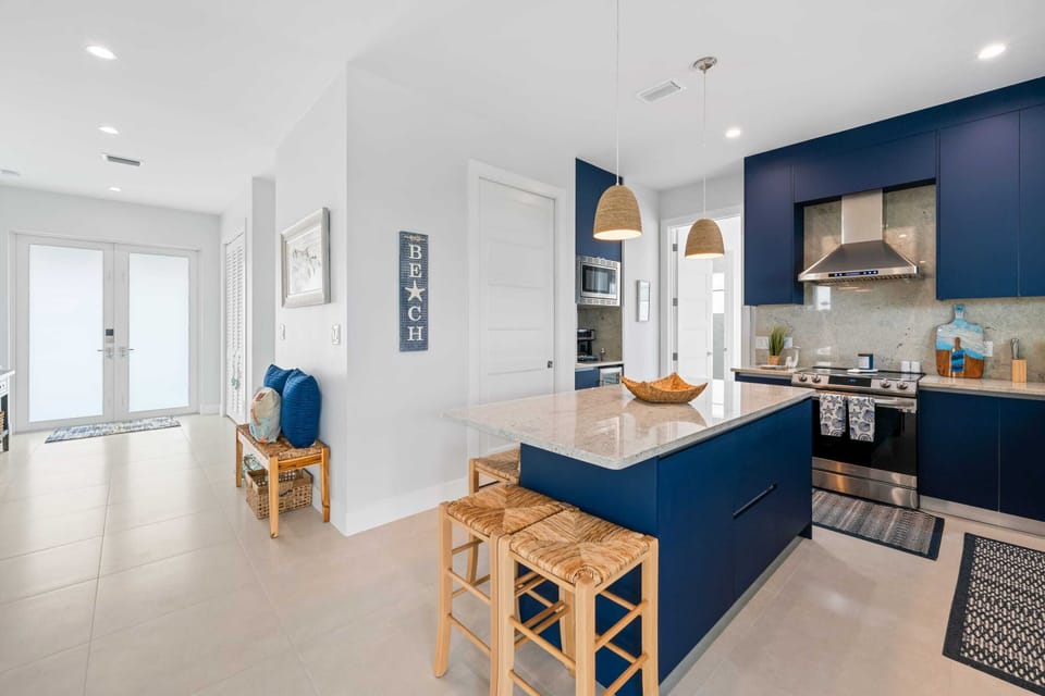 The kitchen island offers a fantastic dining setting for a homemade meal.