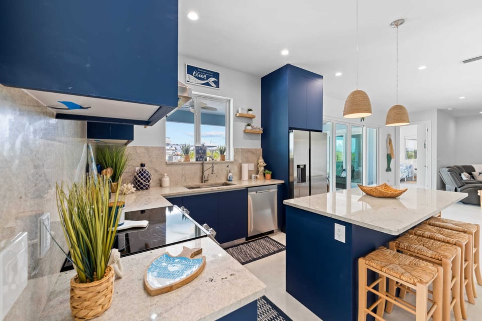 The kitchen island offers a fantastic dining setting for a homemade meal.