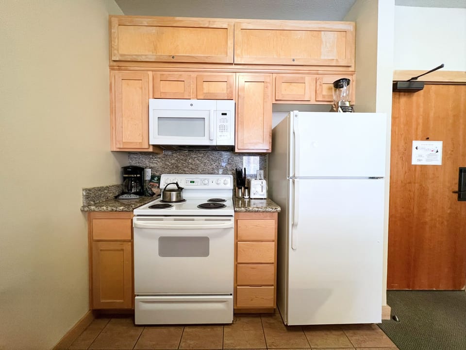Kitchen comes fully stocked with everything needed to cook a meal.