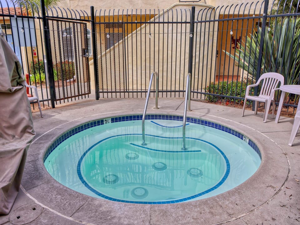 Unwind in the shared hot tub, the perfect spot to chill after sun, sand, and dunes.