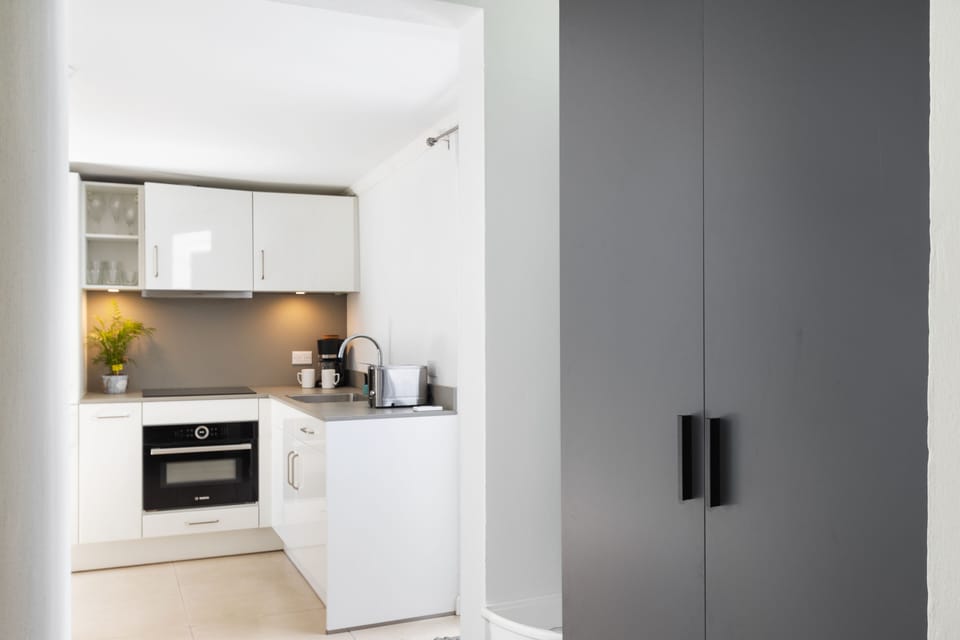 Discover the kitchen area with ample storage space, designed for convenience and organization in your culinary adventures.