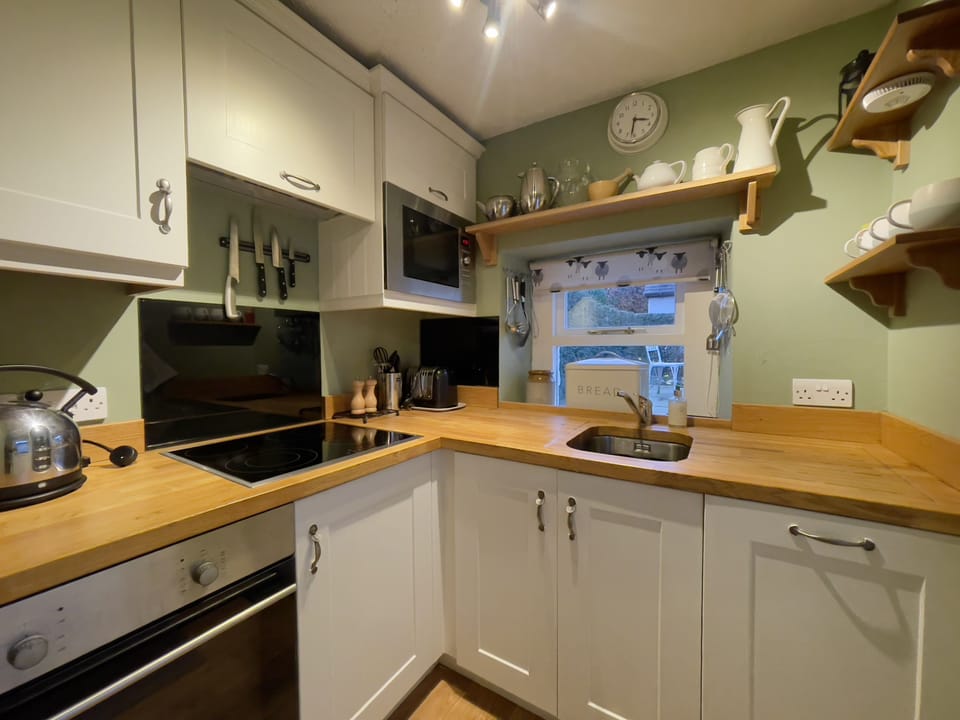 A beautiful country kitchen is at the rear of the property and enjoys views to the garden