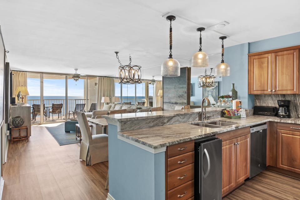 Remodeled Kitchen with granite countertops, stainless appliances - cook delicious meals and dine while overlooking the Gulf of Mexico!