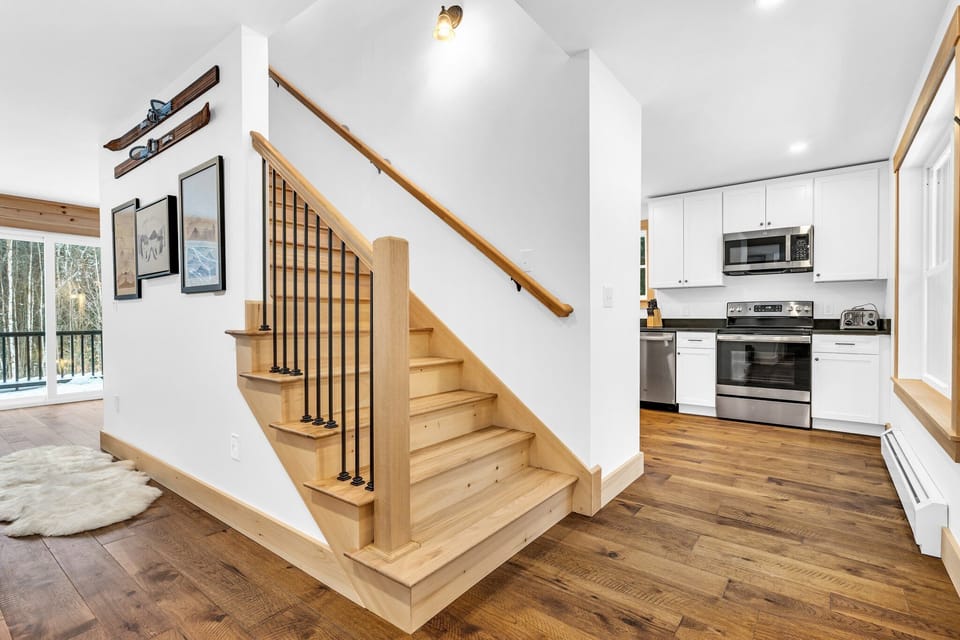 Off the living room and kitchen you will access the upstairs bedrooms. 