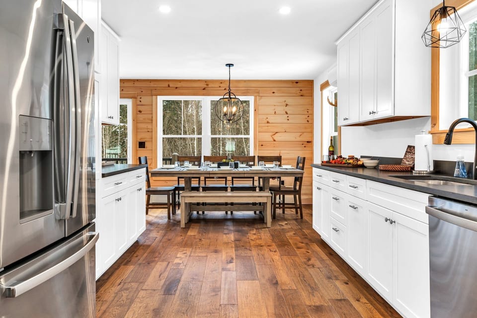 The modern kitchen is open to the dining area making entertaining a breeze!