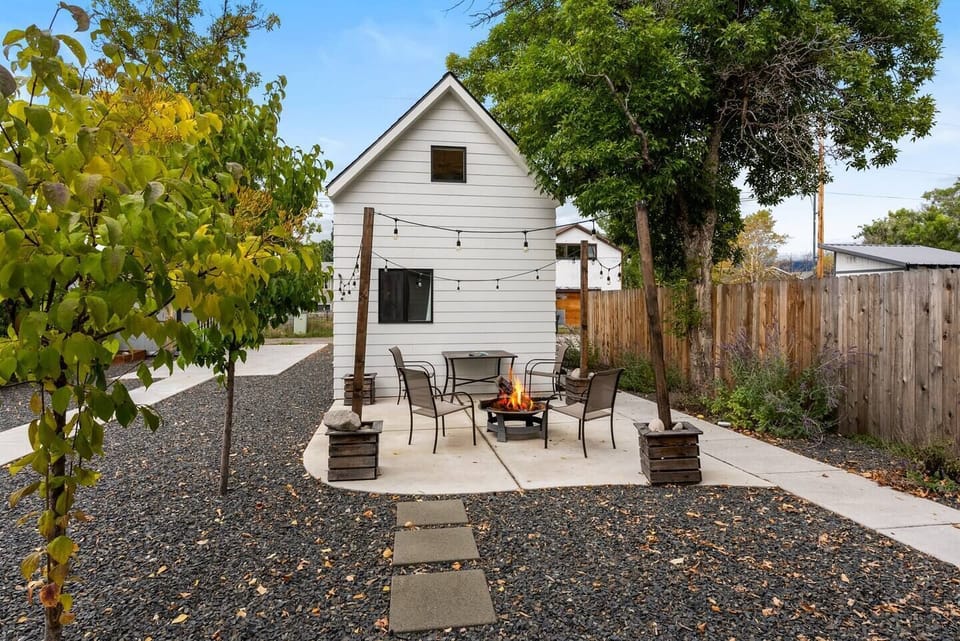 Edison lights, firepit, seating. Firewood available at grocery and gas stations.