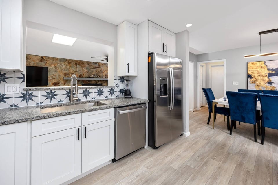 Kitchen Features a Pass-Through Window to the Family Room