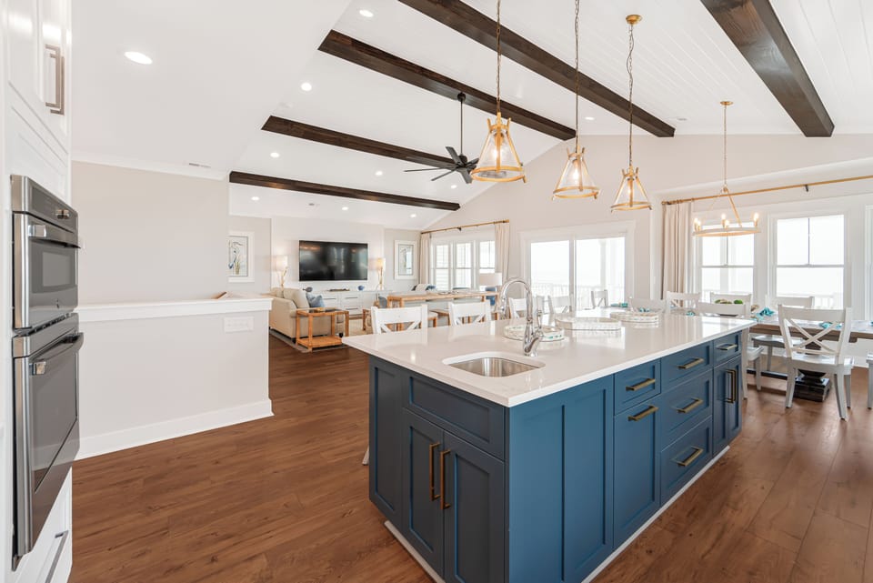 View of the living room from the spacious and well-stocked kitchen.