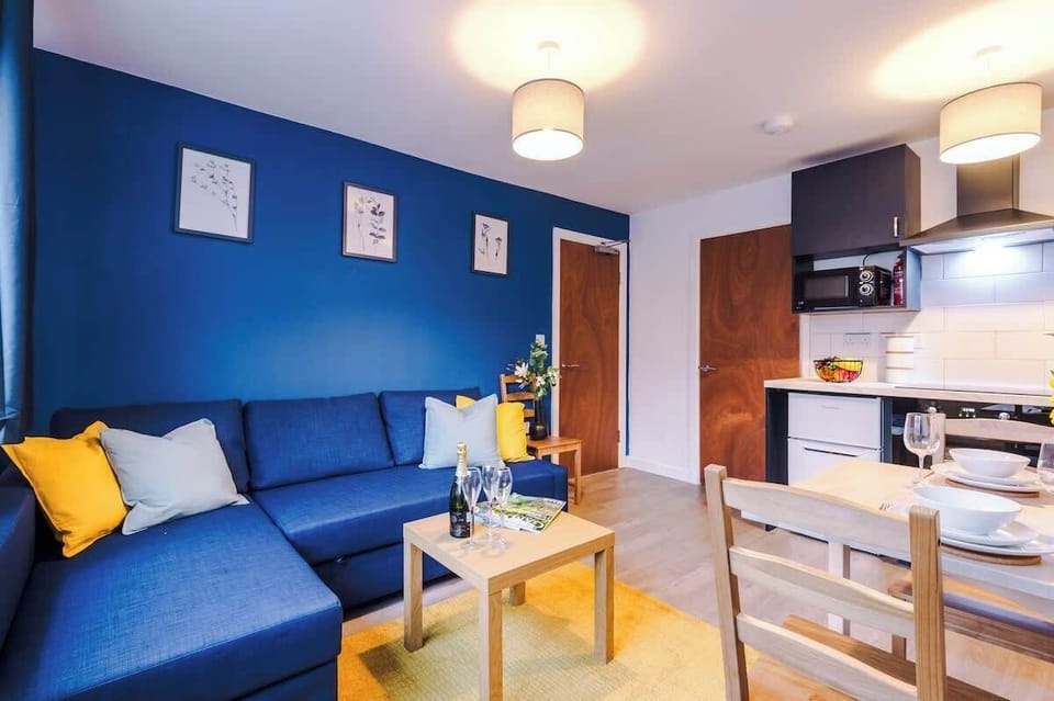 The open plan living room benefits from a double sofa bed, 4 seater dining table and fully equipped kitchen.