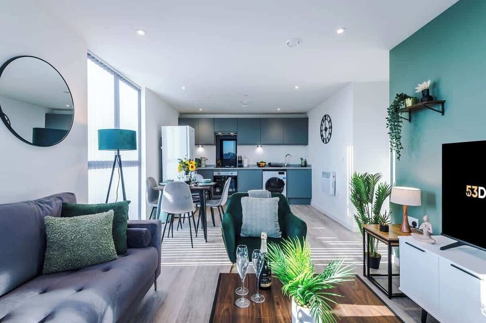 The open-plan living room, dining area and kitchen benefit from a 50-inch Smart TV, a 4-seater dining table, plenty of space to sit down in the evenings and a sizable wrap-around balcony.