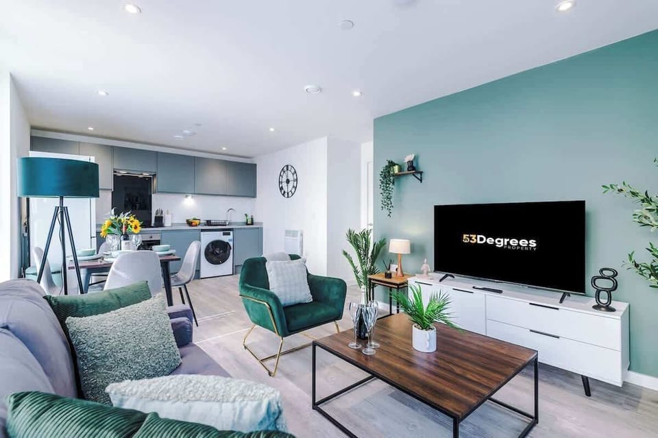 The open-plan living room, dining area and kitchen benefit from a 50-inch Smart TV, a 4-seater dining table, plenty of space to sit down in the evenings and a sizable wrap-around balcony.
