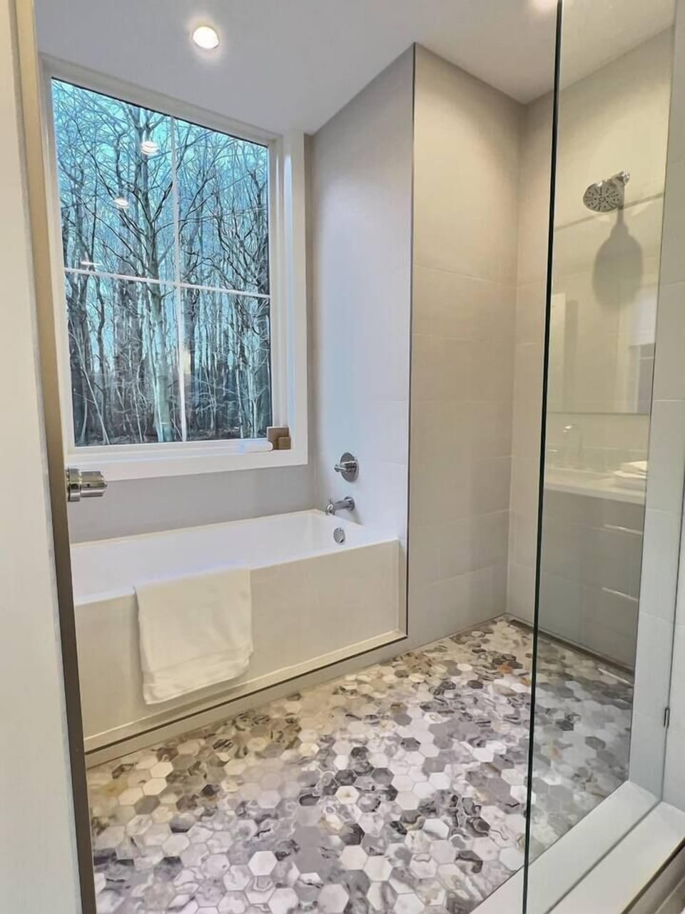 Primary bathroom deep tub and walk in shower