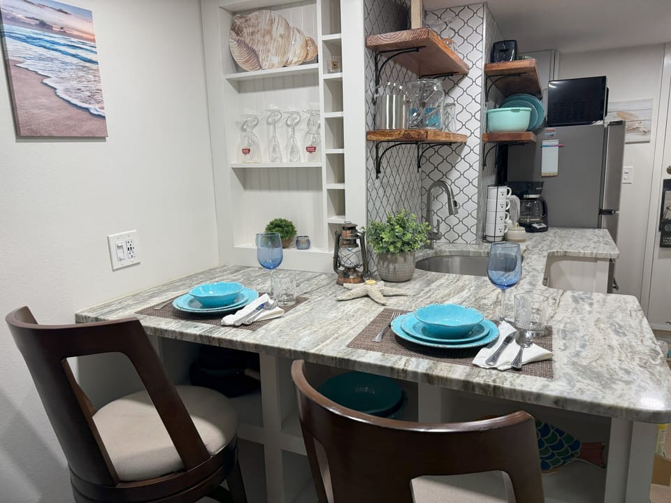 Enjoy a meal or crank out that last work email on comfy bar-height chairs