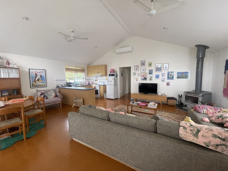 Open living flowing to dining and kitchen