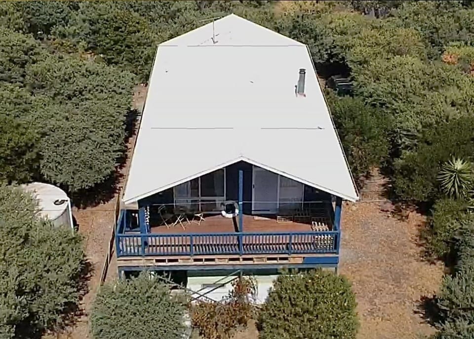 Elevated coastal home set back from the street for privacy