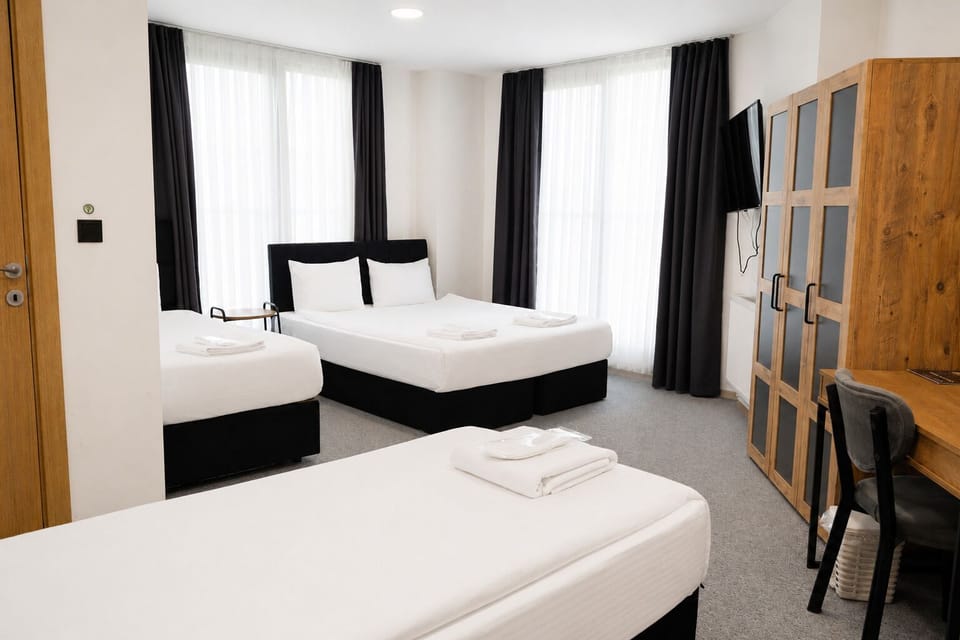 Deluxe Quadruple Room | Egyptian cotton sheets, premium bedding, minibar, desk